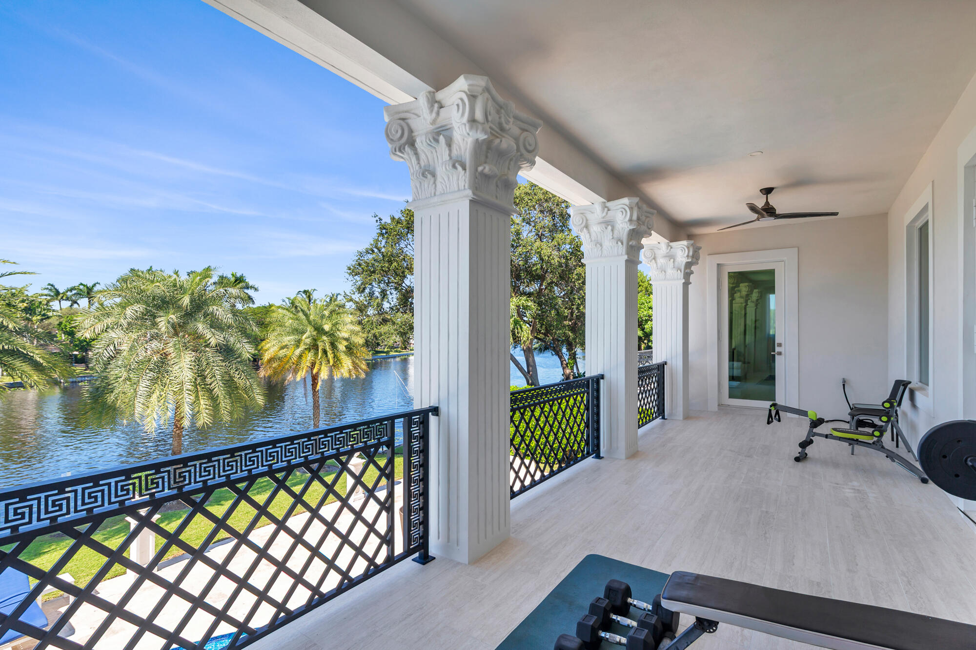 7923 Pine Tree Lane Lake Clarke Shores, FL 33406 - Photo 3 of 70 a view of a balcony with chair and table