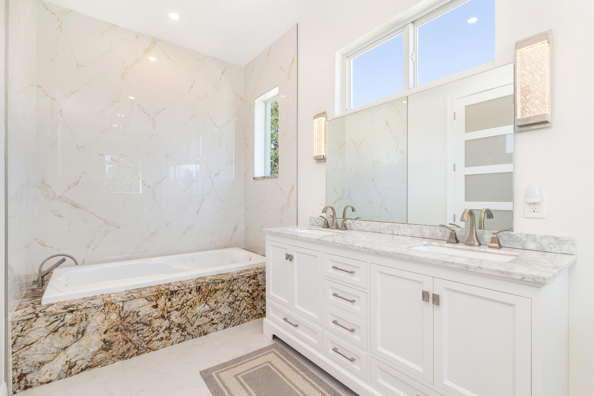 7923 Pine Tree Lane Lake Clarke Shores, FL 33406 - Photo 31 of 70 a bathroom with a sink and a mirror