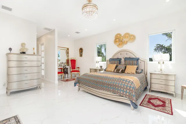 a view of swimming pool with outdoor seating and plants