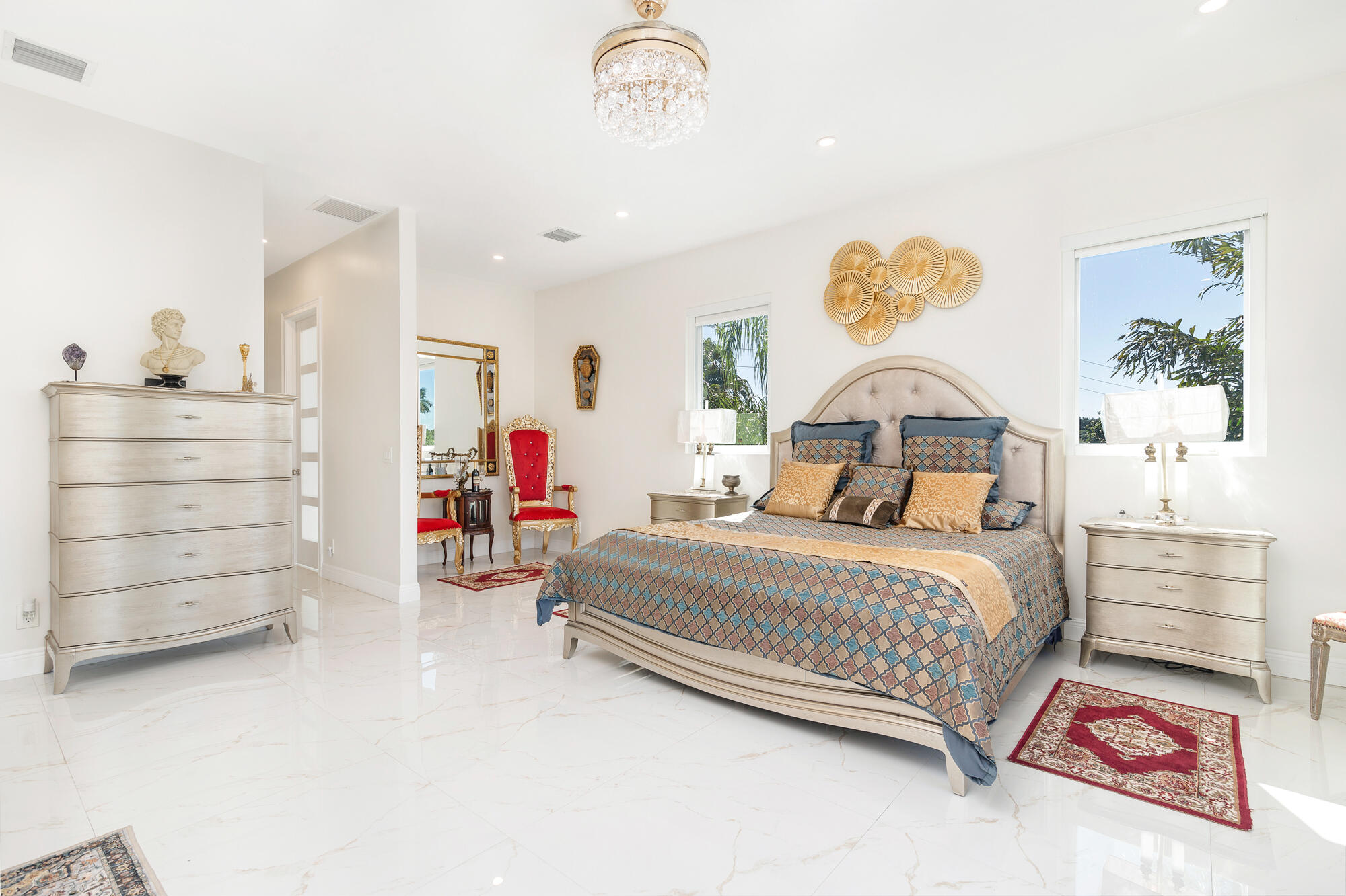 7923 Pine Tree Lane Lake Clarke Shores, FL 33406 - Photo 36 of 70 a bedroom with a bed and a cabinets