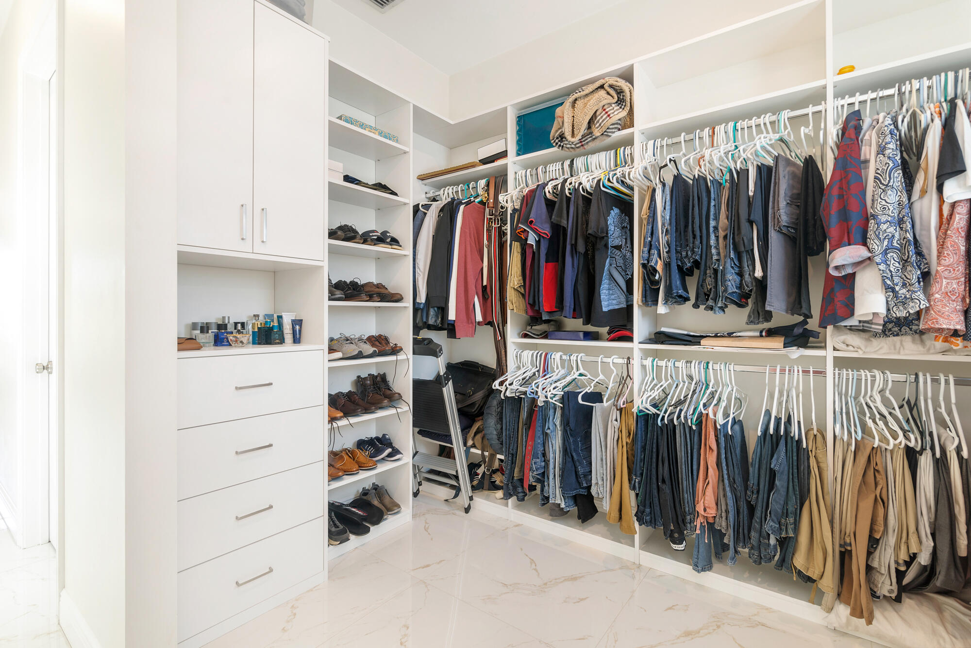 7923 Pine Tree Lane Lake Clarke Shores, FL 33406 - Photo 38 of 70 a view of walk in closet with clothes and shoes