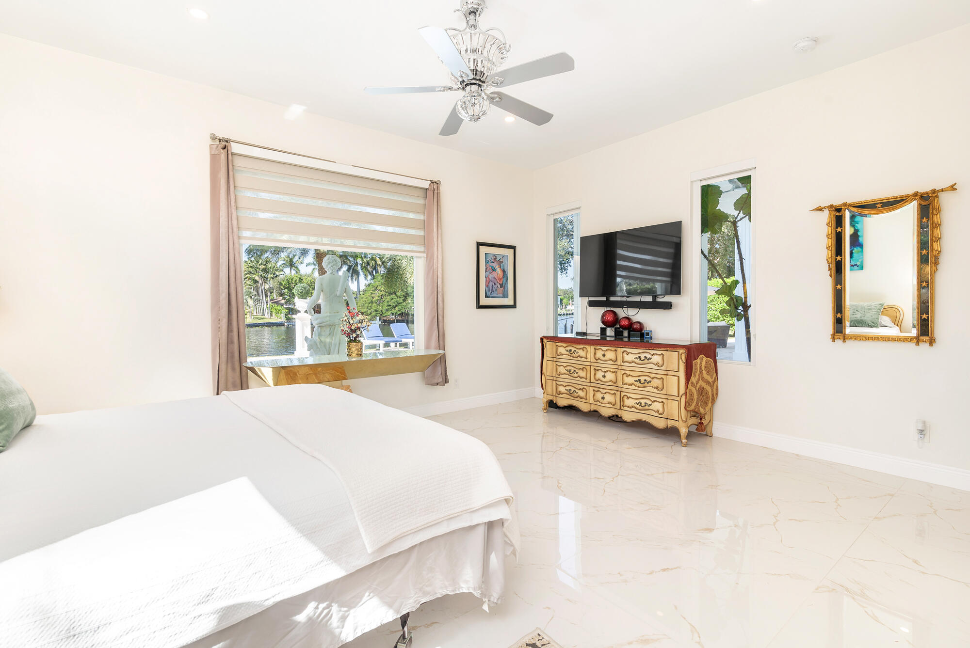 7923 Pine Tree Lane Lake Clarke Shores, FL 33406 - Photo 40 of 70 a bedroom with a bed and a couch