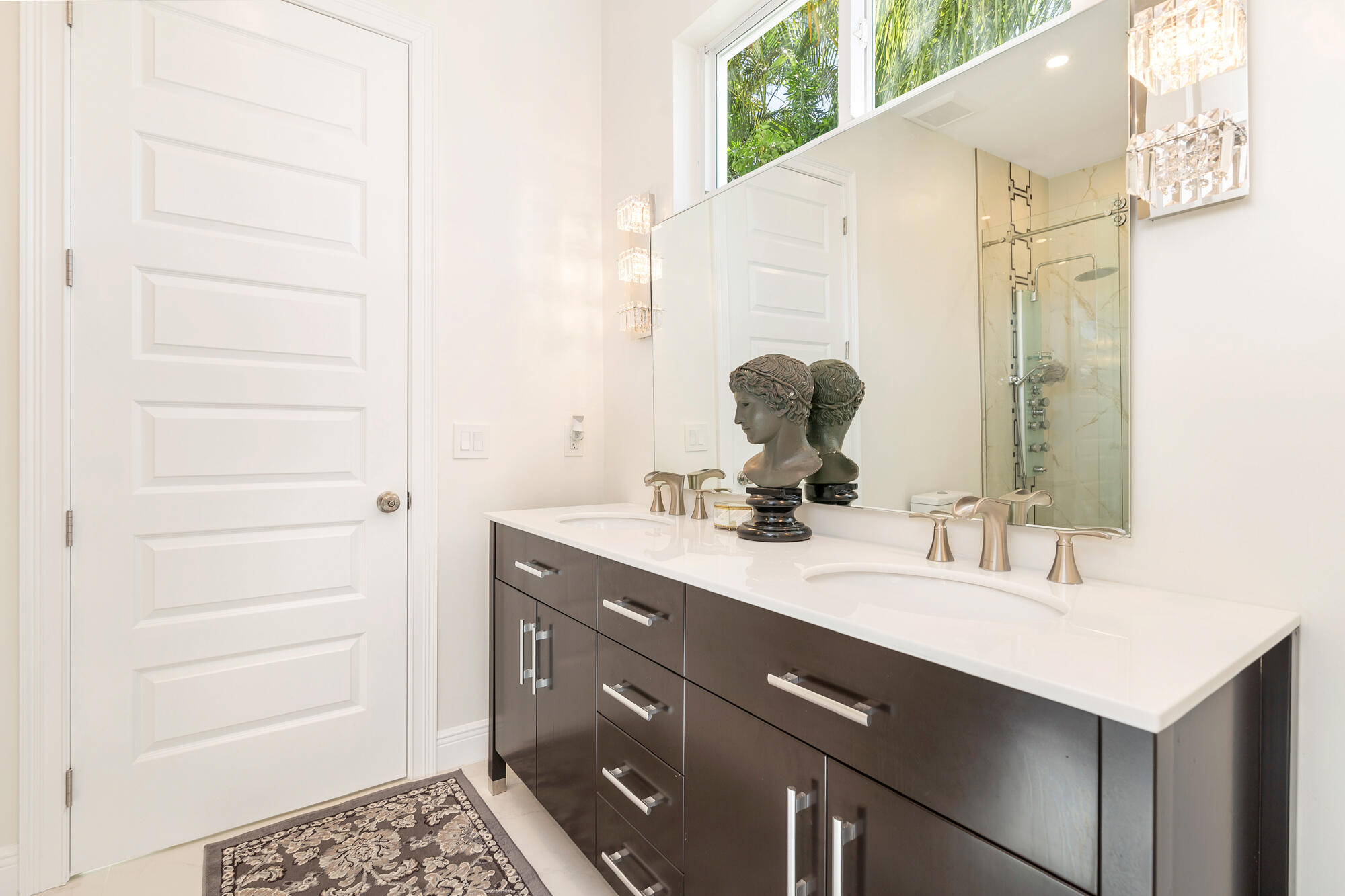 7923 Pine Tree Lane Lake Clarke Shores, FL 33406 - Photo 41 of 70 a bathroom with a sink vanity and a mirror