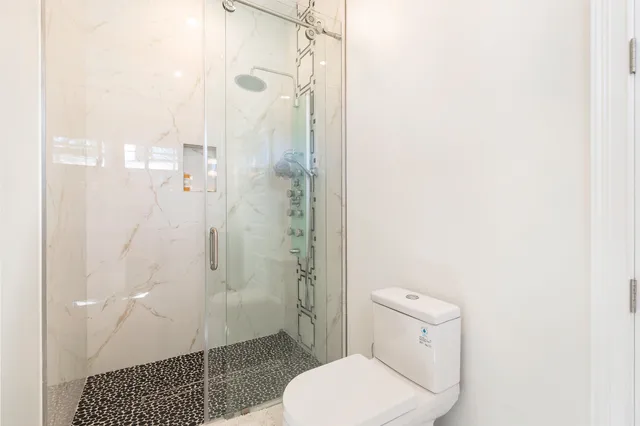 an aerial view of a house with swimming pool garden and patio