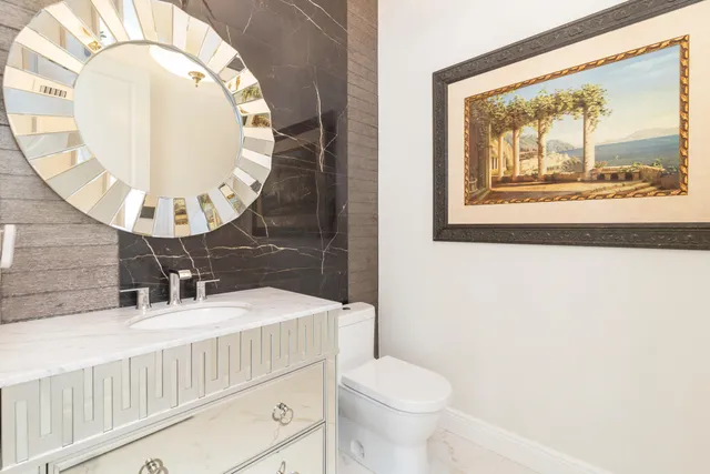 an aerial view of residential houses with outdoor space and river