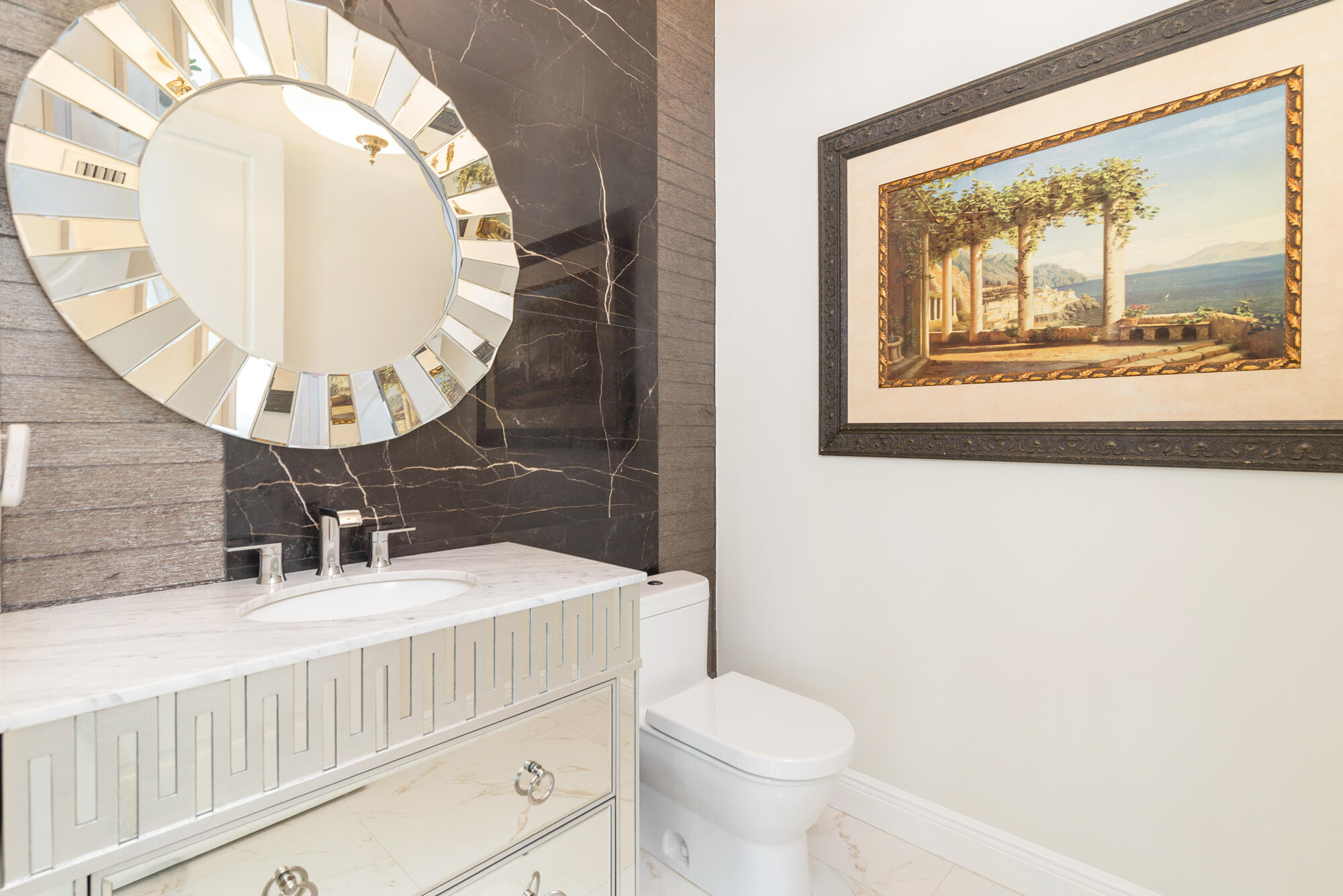 7923 Pine Tree Lane Lake Clarke Shores, FL 33406 - Photo 45 of 70 a bathroom with a sink and a mirror