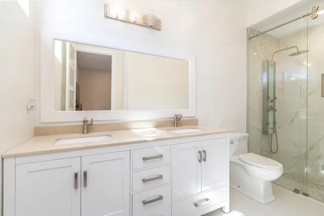 an aerial view of a houses with a lake view