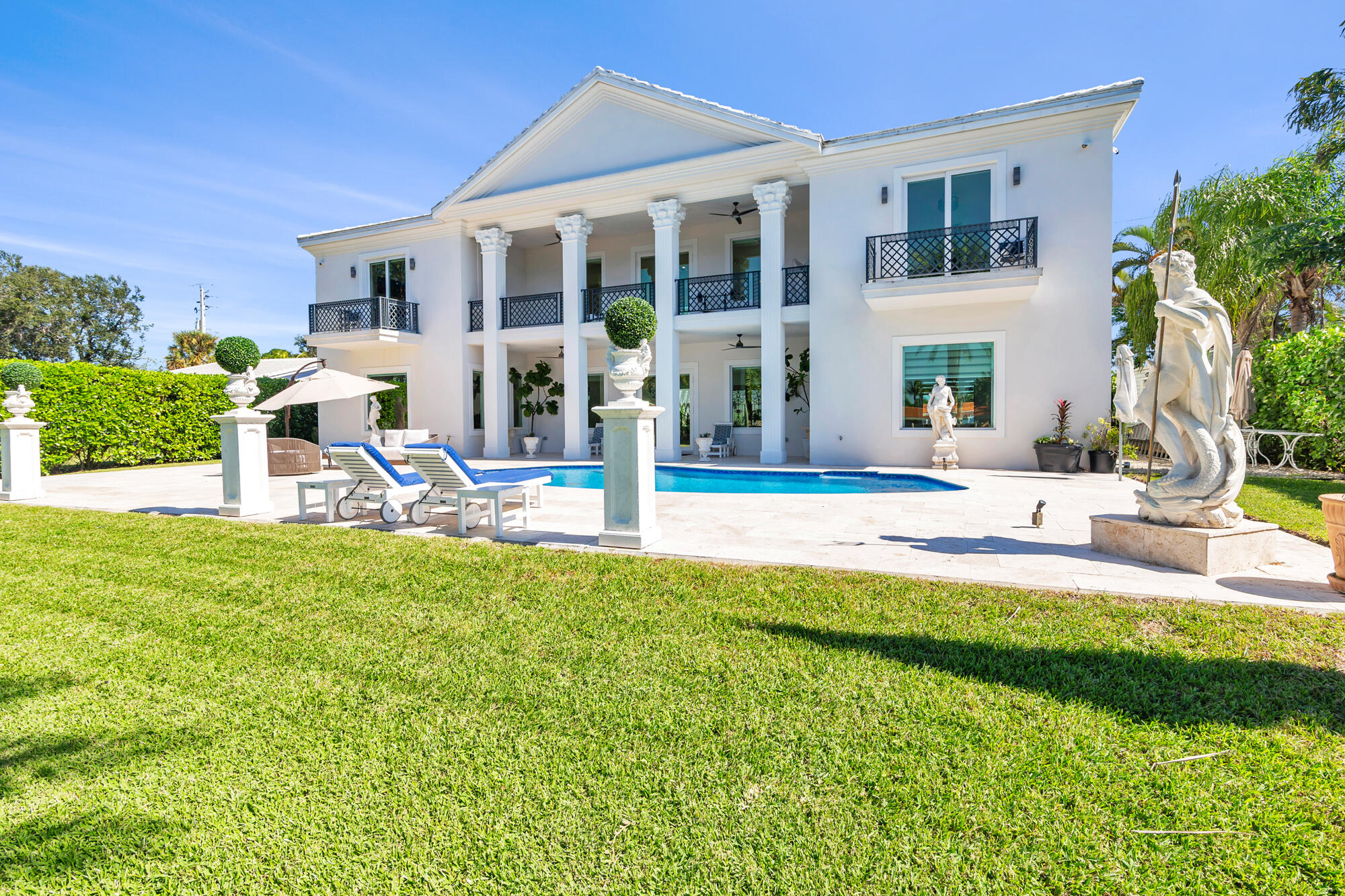 7923 Pine Tree Lane Lake Clarke Shores, FL 33406 - Photo 51 of 70 a view of a house with a yard patio and swimming pool