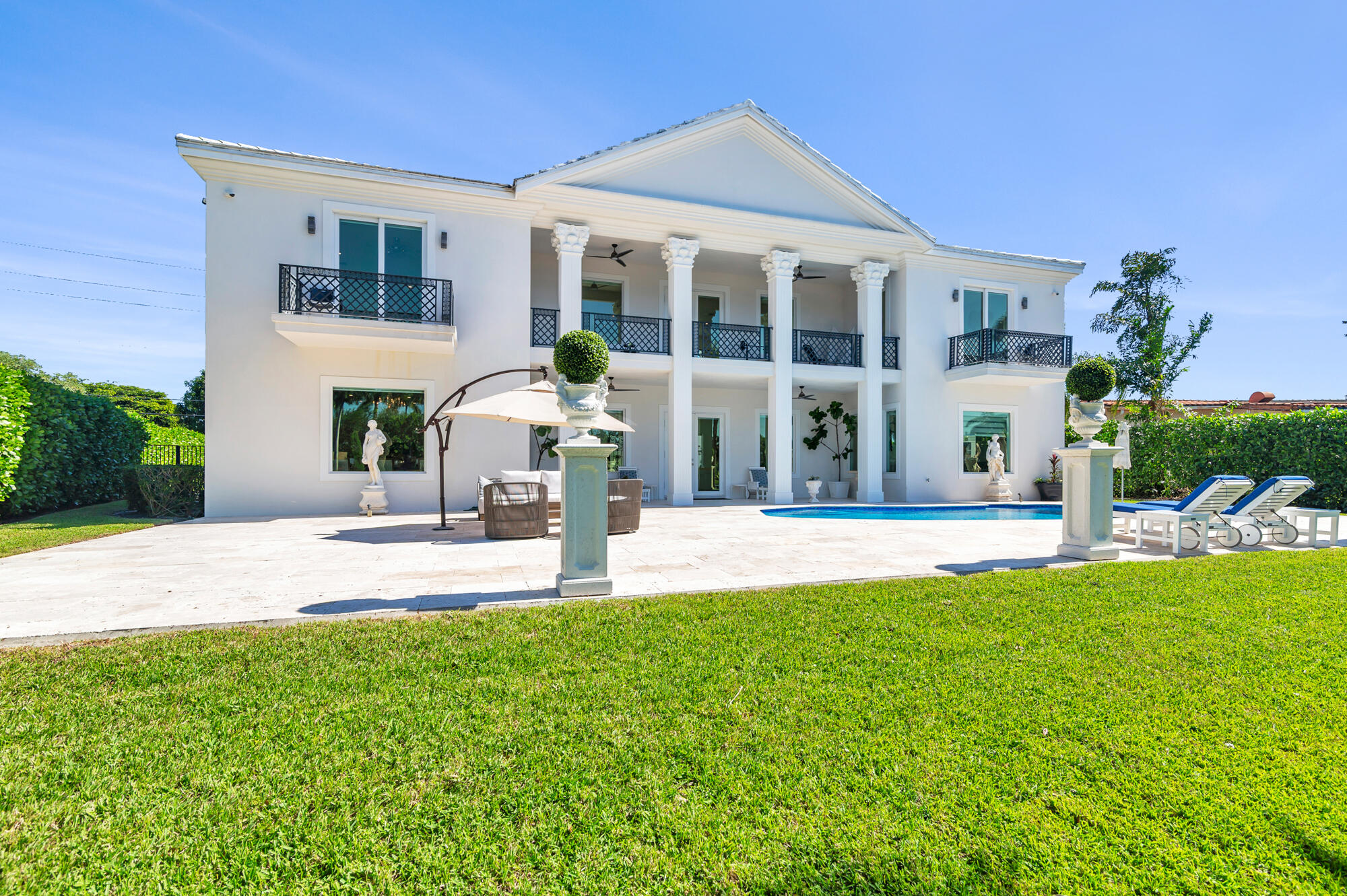 7923 Pine Tree Lane Lake Clarke Shores, FL 33406 - Photo 52 of 70 a view of a house with a yard and sitting area