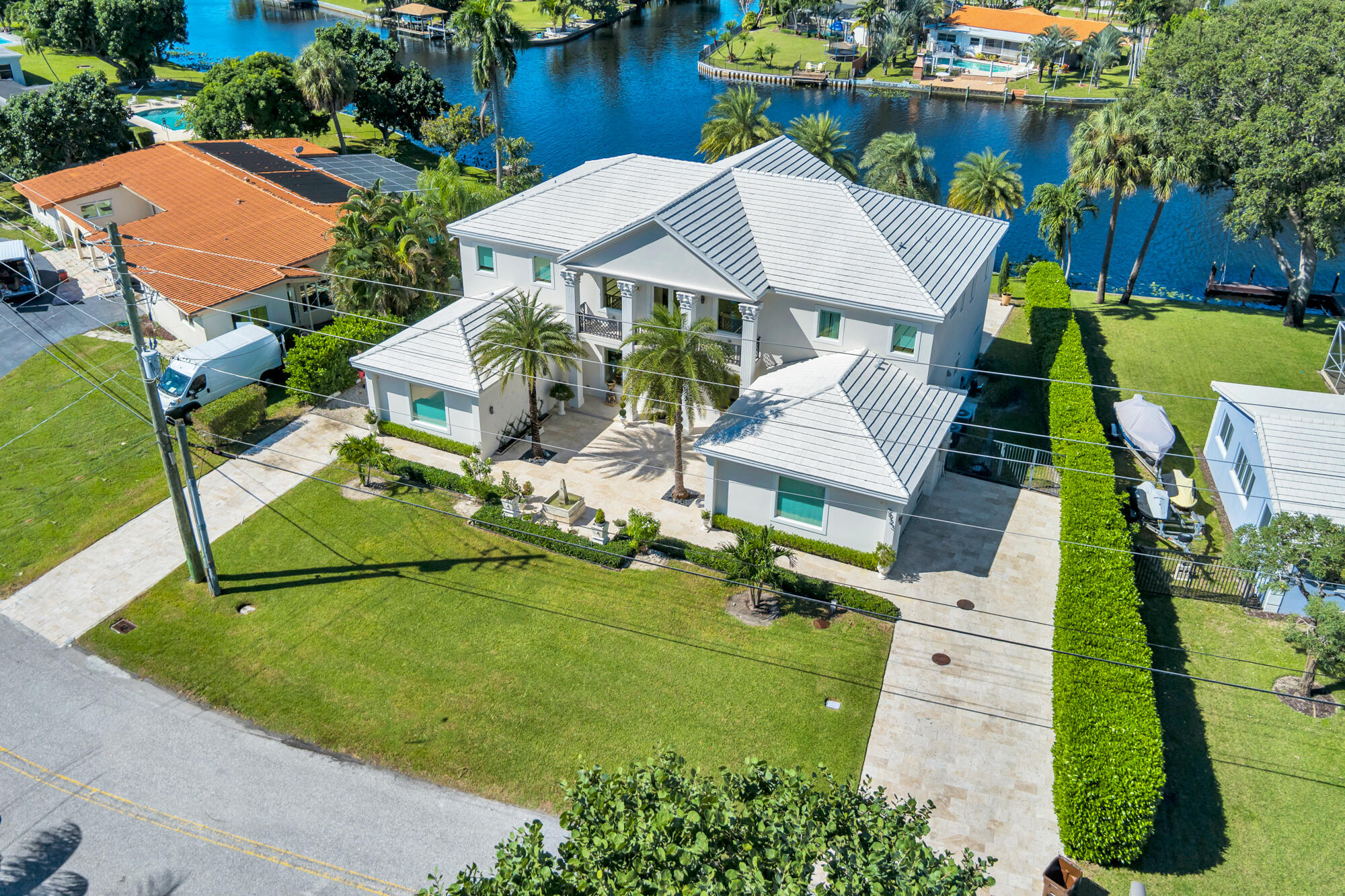 7923 Pine Tree Lane Lake Clarke Shores, FL 33406 - Photo 55 of 70 an aerial view of a house with swimming pool garden and patio