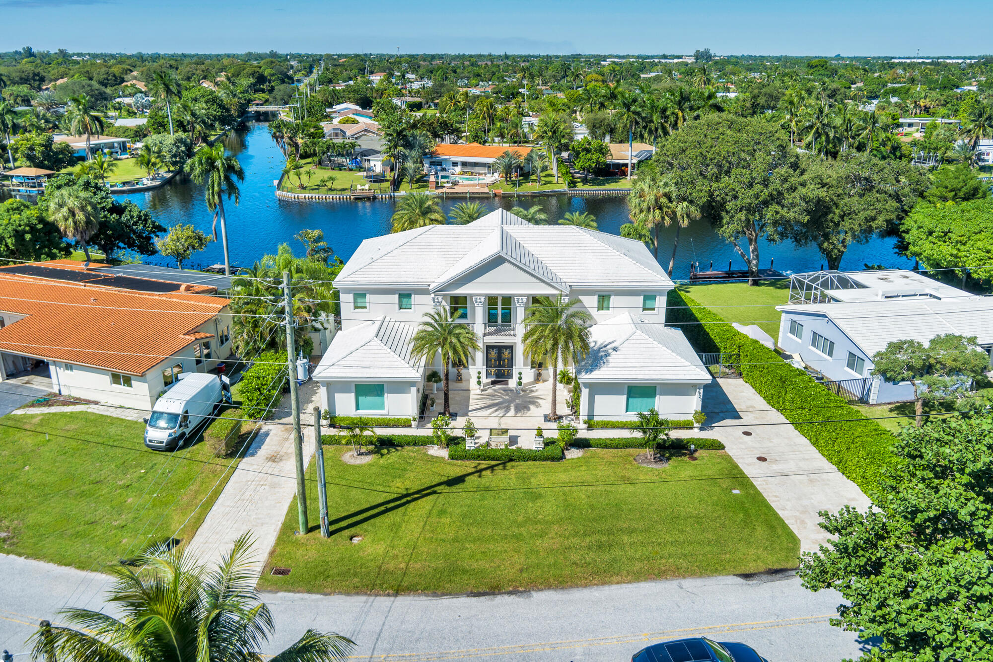 7923 Pine Tree Lane Lake Clarke Shores, FL 33406 - Photo 56 of 70 an aerial view of a house with a garden and swimming pool
