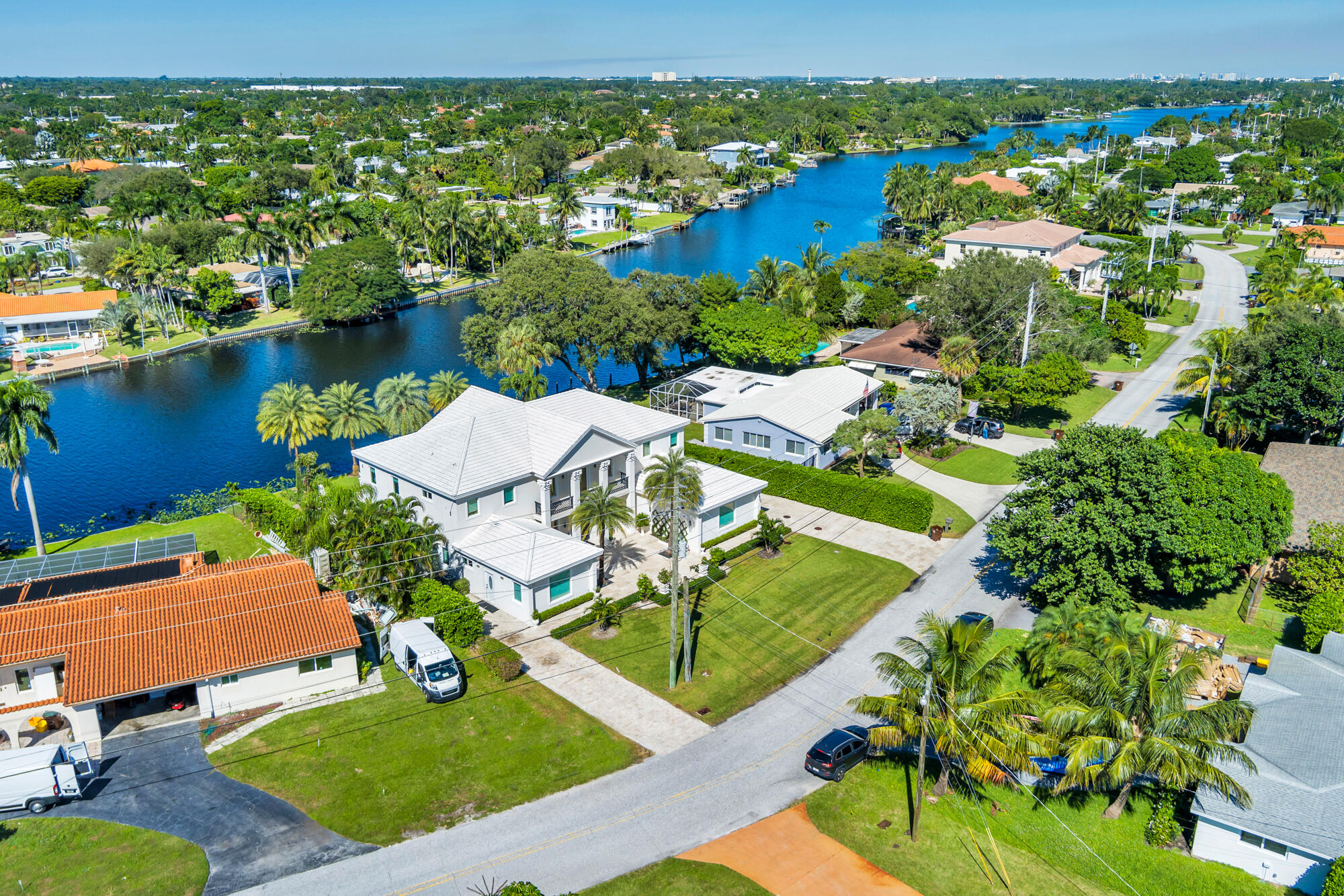 7923 Pine Tree Lane Lake Clarke Shores, FL 33406 - Photo 58 of 70 an aerial view of residential houses with outdoor space and river