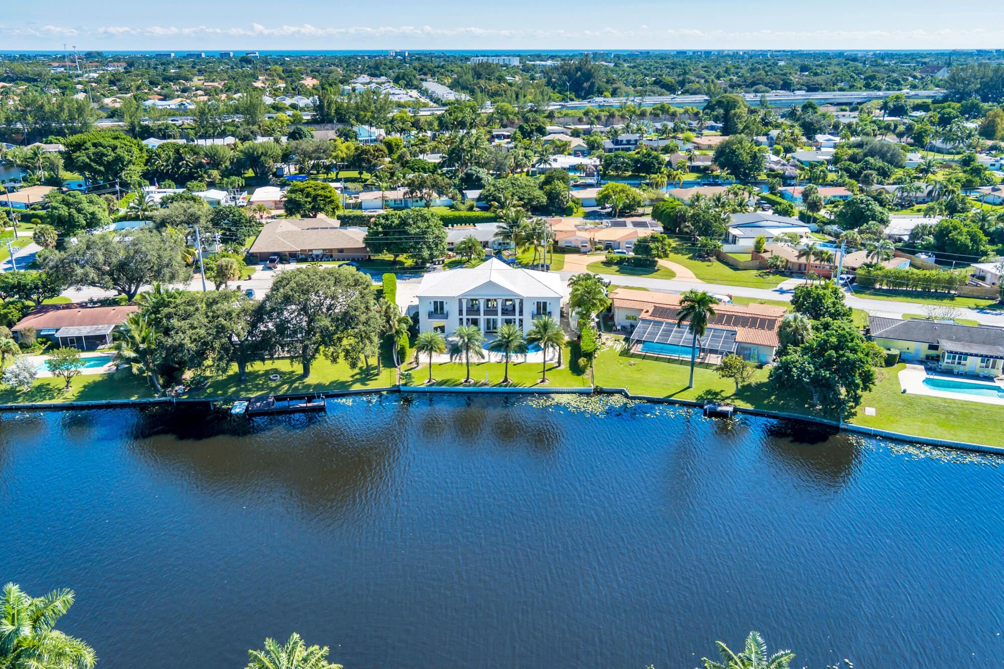 7923 Pine Tree Lane Lake Clarke Shores, FL 33406 - Photo 61 of 70 an aerial view of a houses with a lake view