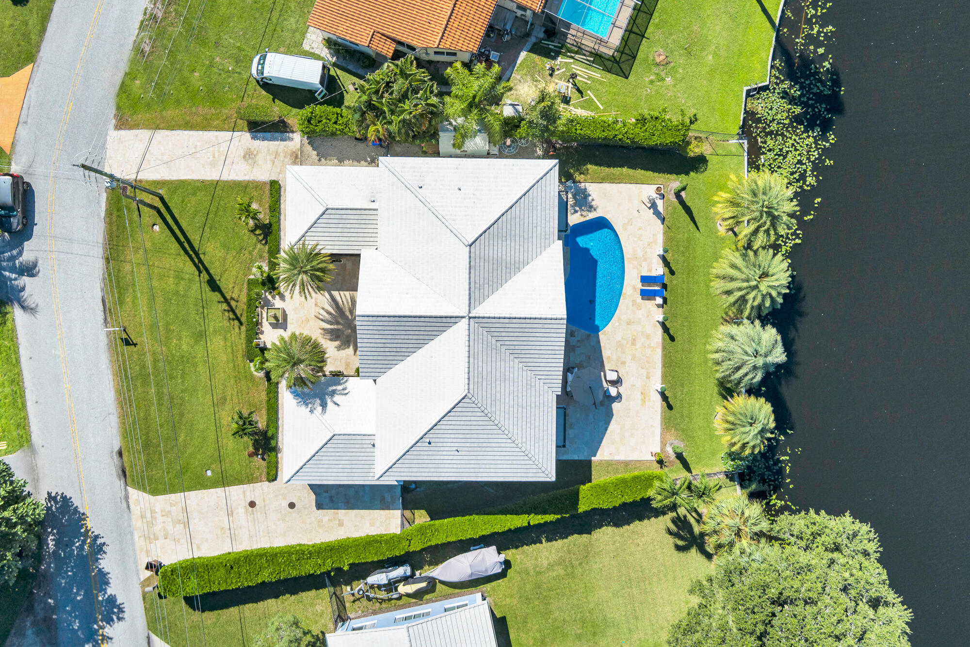 7923 Pine Tree Lane Lake Clarke Shores, FL 33406 - Photo 64 of 70 an aerial view of a house with a yard swimming pool and outdoor seating