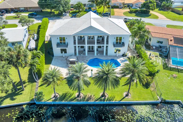 a front view of house with yard and outdoor seating