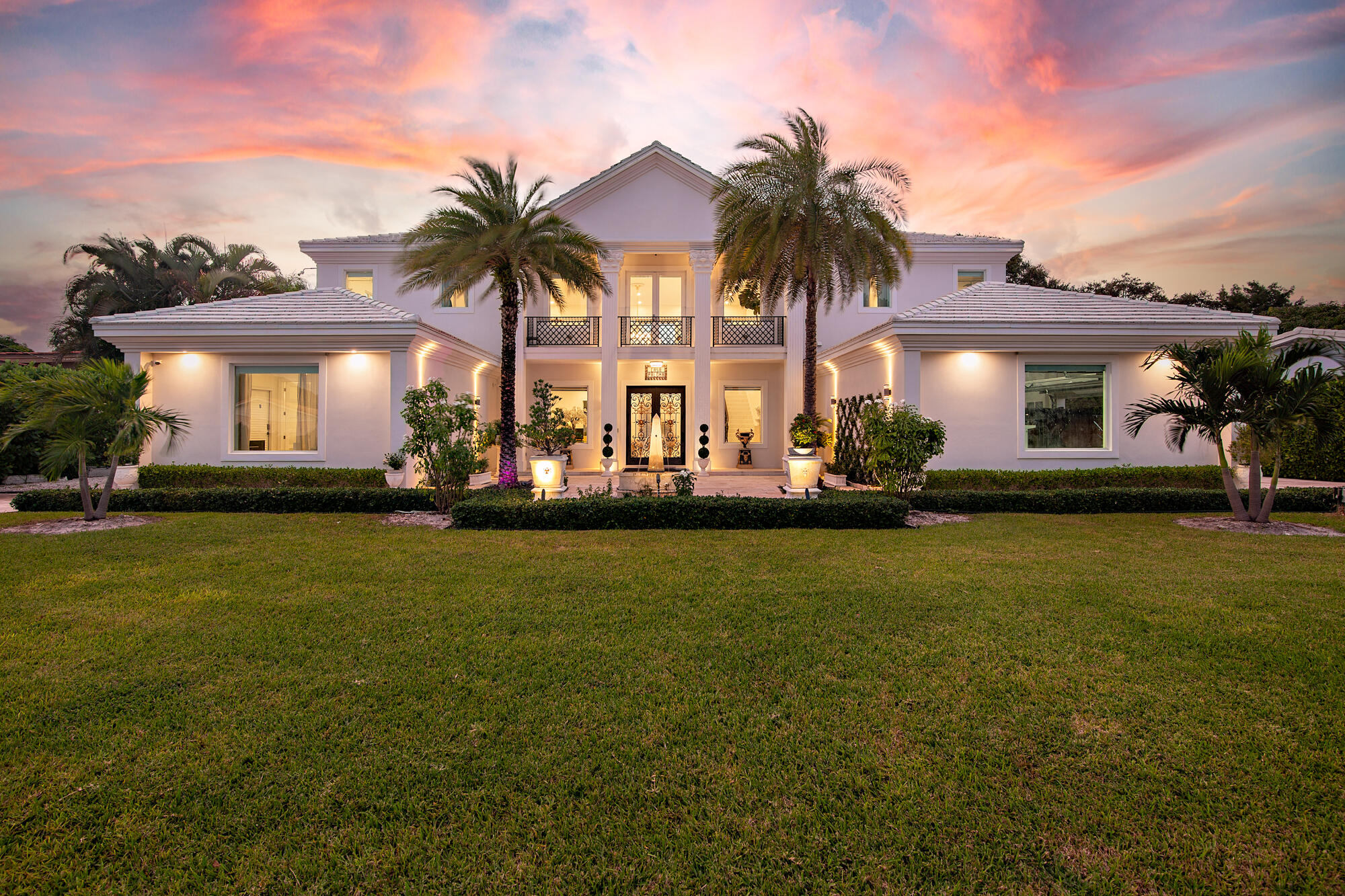 7923 Pine Tree Lane Lake Clarke Shores, FL 33406 - Photo 8 of 70 a front view of house with yard and lake view