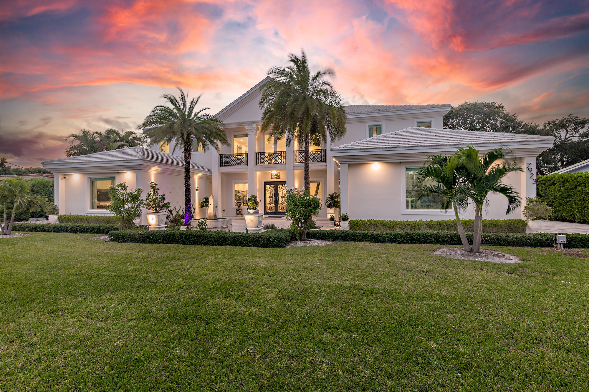 7923 Pine Tree Lane Lake Clarke Shores, FL 33406 - Photo 10 of 70 a front view of house with yard and outdoor seating