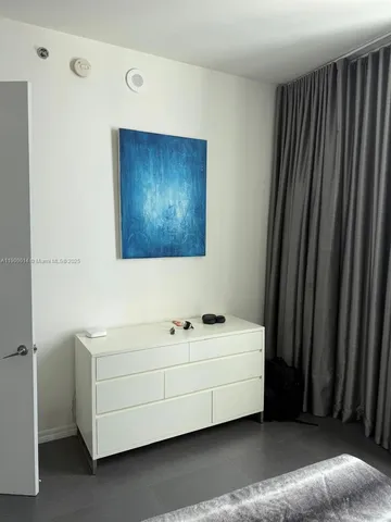 a bathroom with a sink a mirror and shower