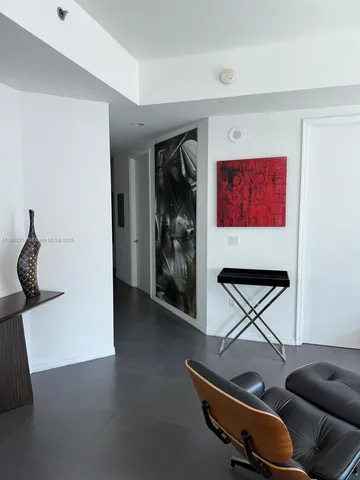 a room with furniture and gym equipment