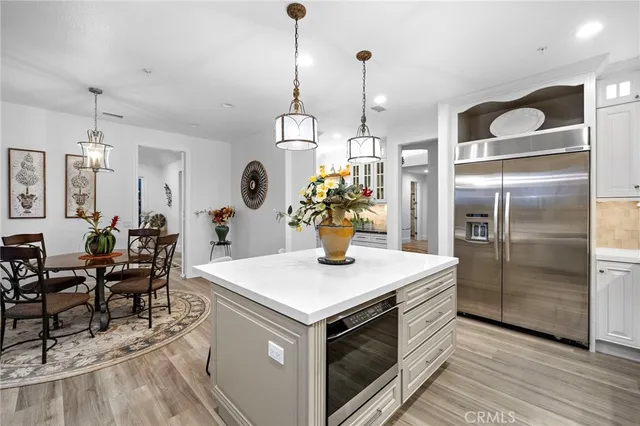 a kitchen with stainless steel appliances granite countertop wooden cabinets a sink and dishwasher