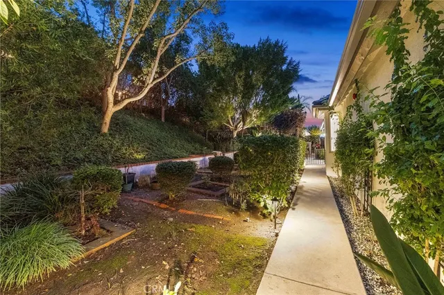 a view of a patio with dining table and chairs with wooden floor