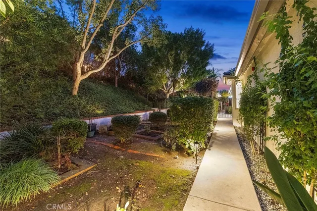 a view of a patio with table and chairs and potted plants