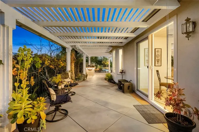 a living room with furniture and a book shelf