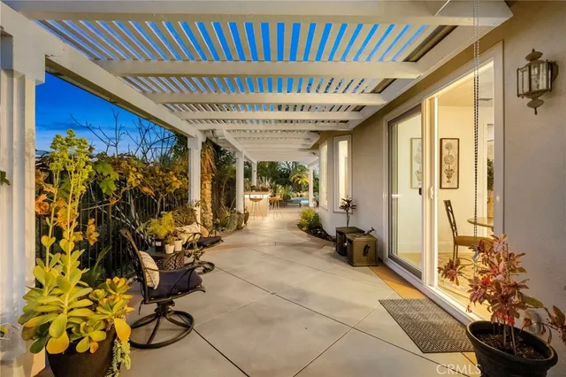 a living room with furniture and a book shelf