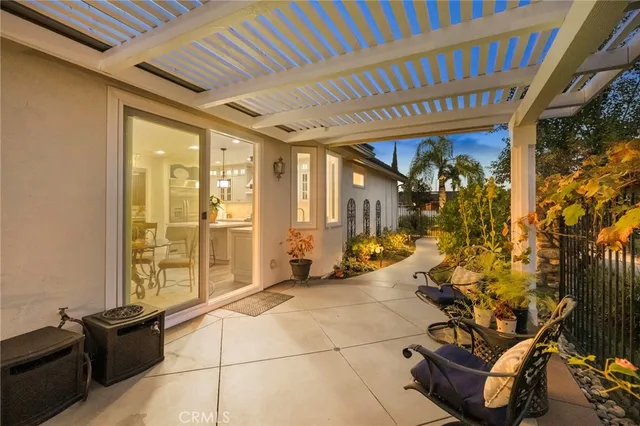 a view of a a dining room with furniture window and wooden floor