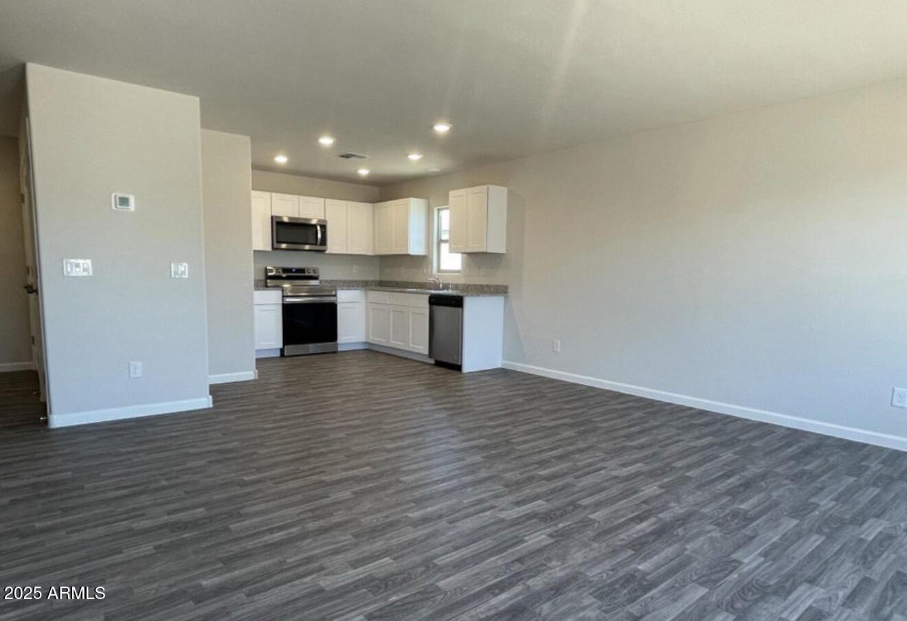 251 South Picacho Heights Road Eloy, AZ 85131 - Photo 11 of 19 a view of kitchen with kitchen island microwave and stove