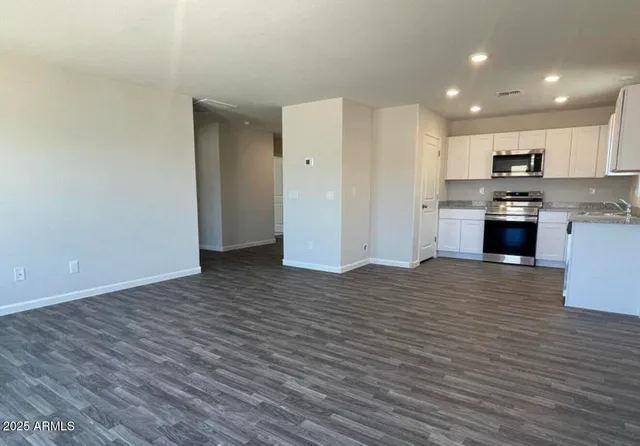a view of kitchen and wooden floor