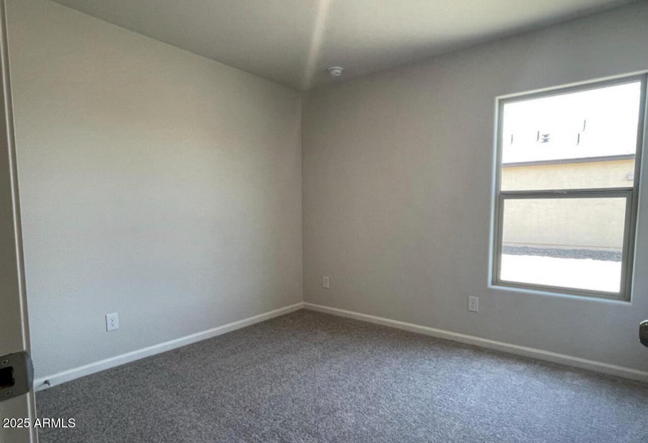 251 South Picacho Heights Road Eloy, AZ 85131 - Photo 7 of 19 an empty room with a window