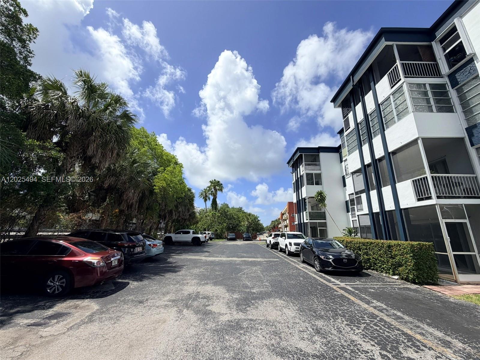9159 Southwest 77th Avenue, Unit 112 Miami, FL 33156 - Photo 34 of 38 a view of street with parked cars