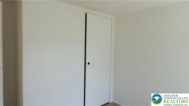 a white toilet and tub sitting next to a bathroom sink