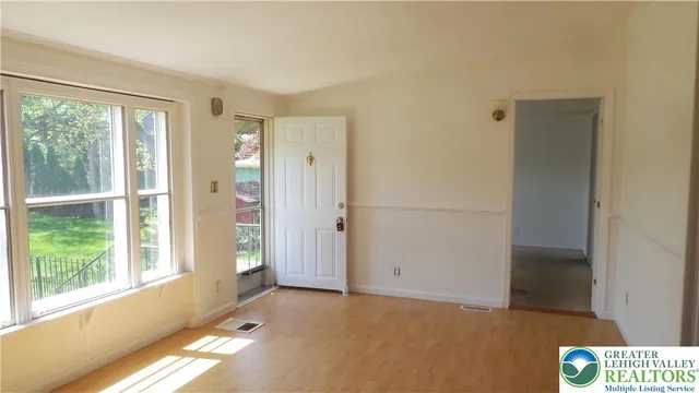 a view of an empty room with a window