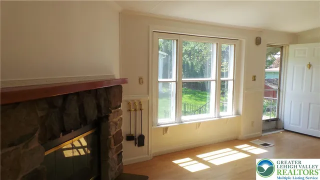 a view of an empty room with a window
