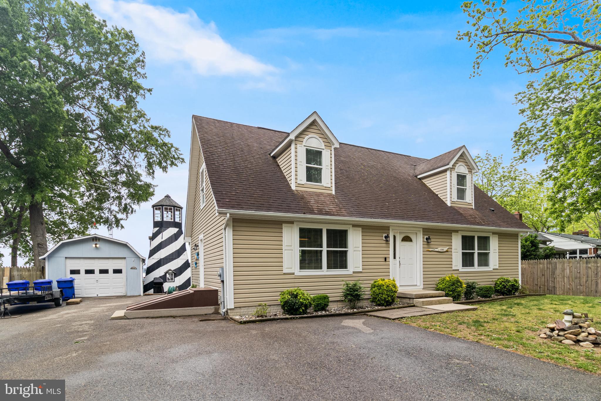 12015 Woodbury Road Nanjemoy, MD 20662 - Photo 2 of 53 a front view of a house with a yard and garage