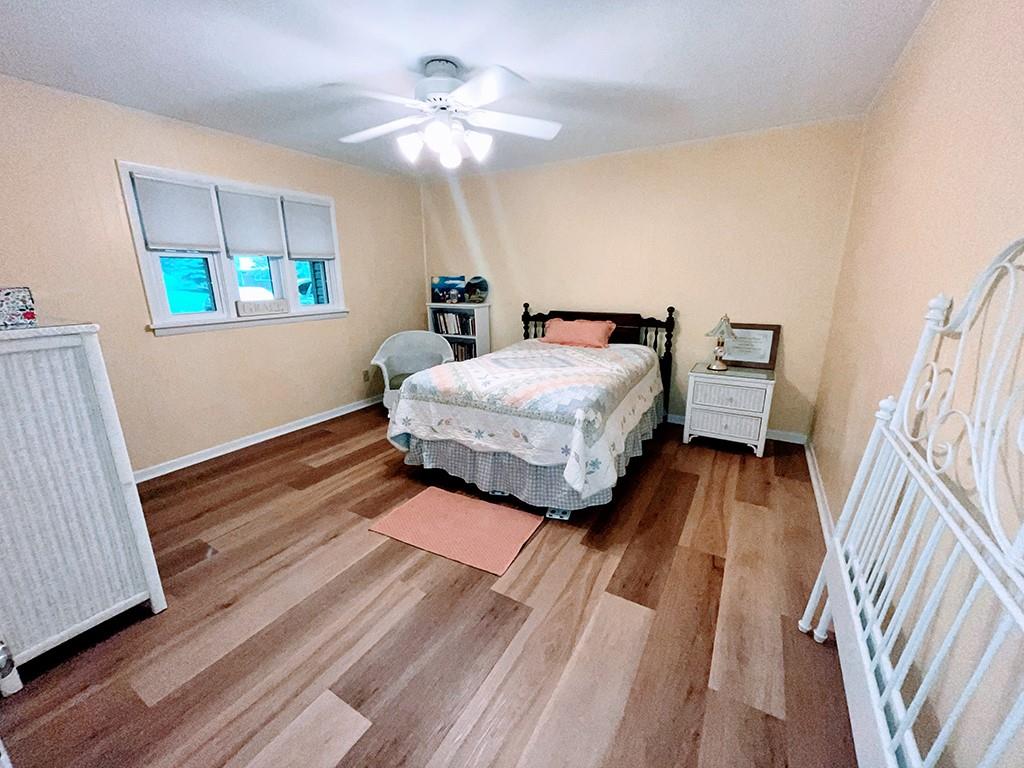 1260 Lions Health Camp Road Indiana, PA 15701 - Photo 11 of 34 a spacious bedroom with a bed and a chandelier