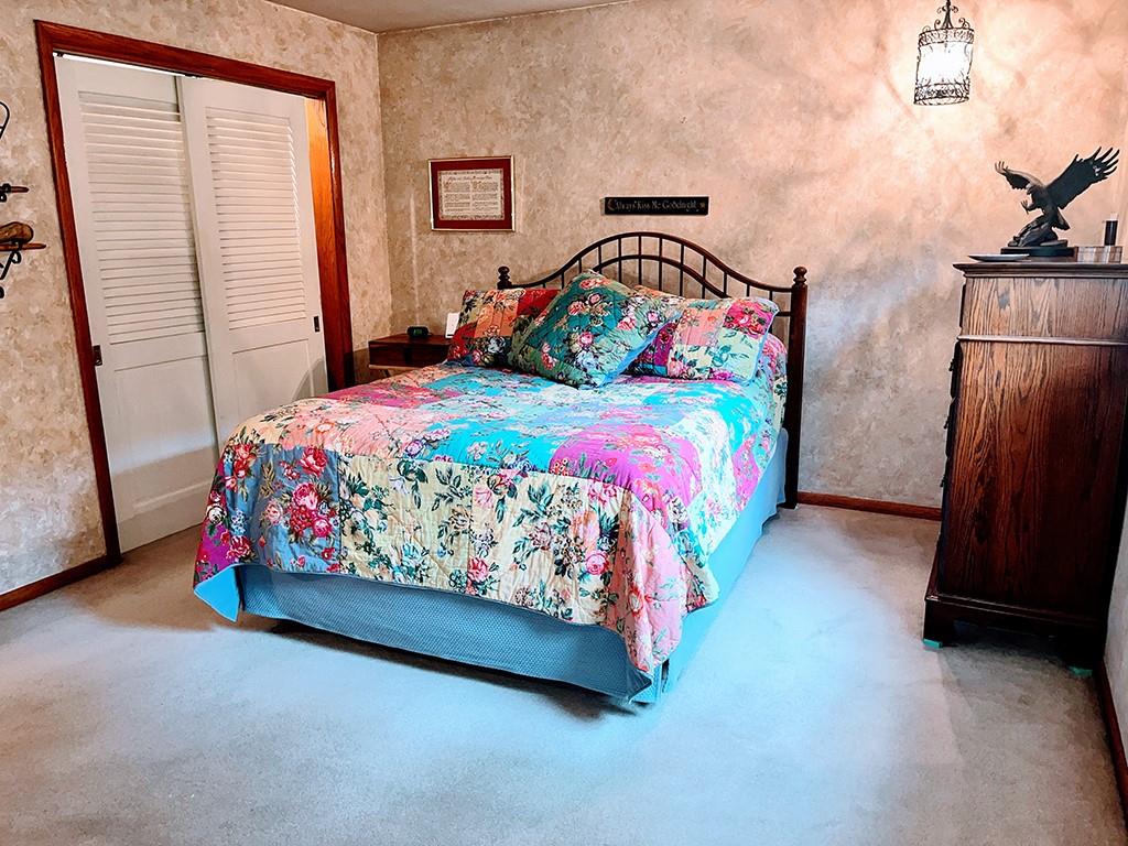 1260 Lions Health Camp Road Indiana, PA 15701 - Photo 12 of 34 a bedroom with a bed and a mirror