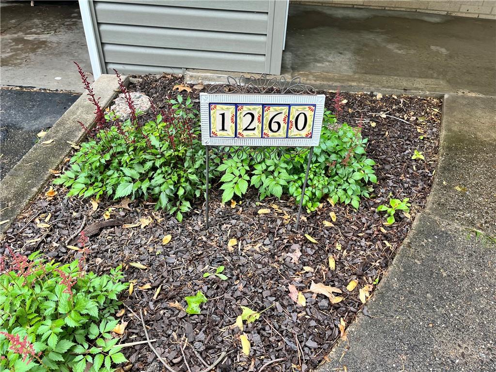 1260 Lions Health Camp Road Indiana, PA 15701 - Photo 2 of 34 a street sign that is sitting in the garden