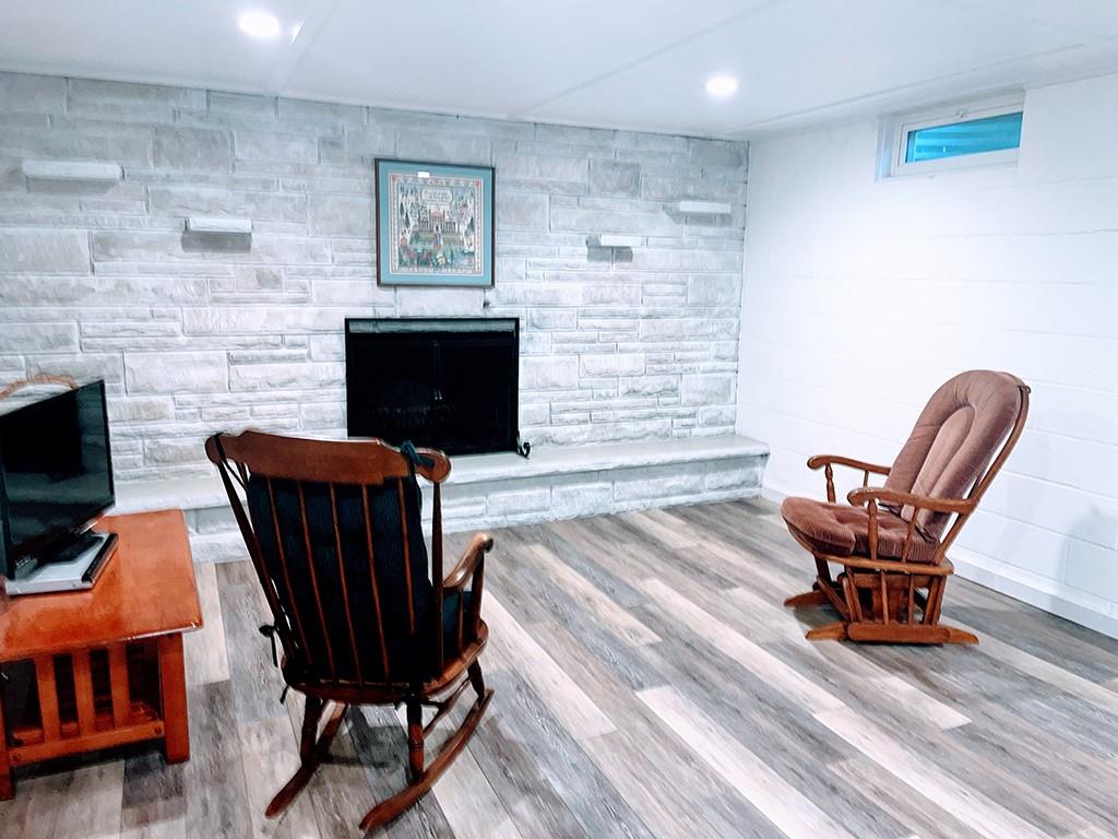 1260 Lions Health Camp Road Indiana, PA 15701 - Photo 21 of 34 a living room with furniture a flat screen tv and a fireplace
