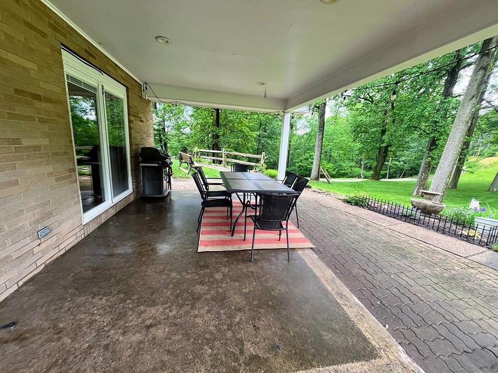 1260 Lions Health Camp Road Indiana, PA 15701 - Photo 24 of 34 a view of a patio with a dining table and chairs