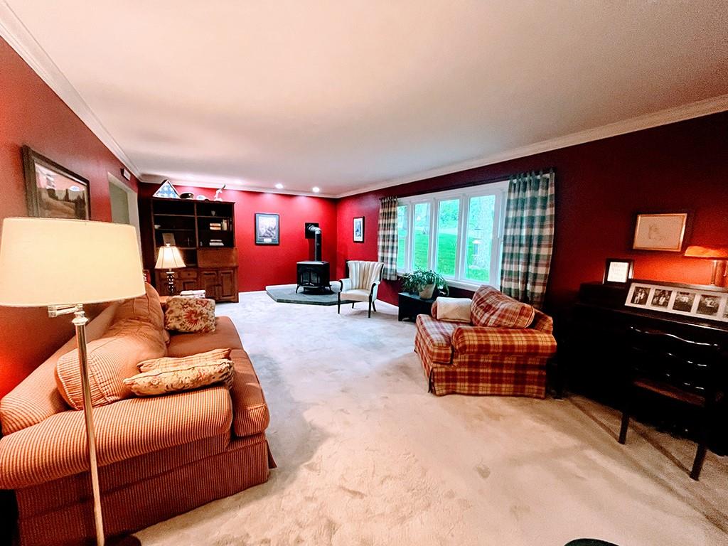 1260 Lions Health Camp Road Indiana, PA 15701 - Photo 5 of 34 a living room with furniture a fireplace and large windows