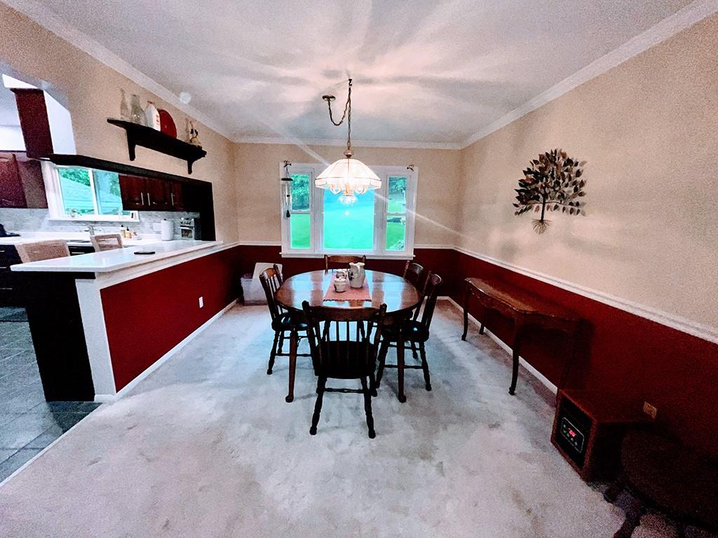1260 Lions Health Camp Road Indiana, PA 15701 - Photo 6 of 34 a dining room with a wooden table and chairs