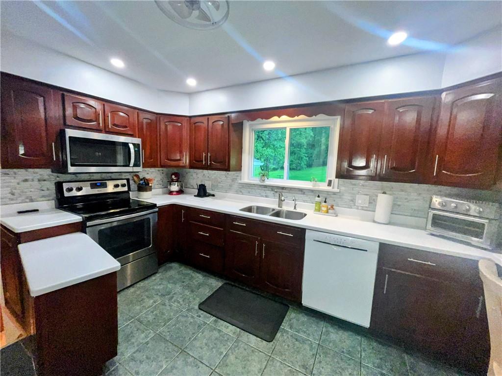 1260 Lions Health Camp Road Indiana, PA 15701 - Photo 7 of 34 a kitchen with a sink stove top oven and refrigerator