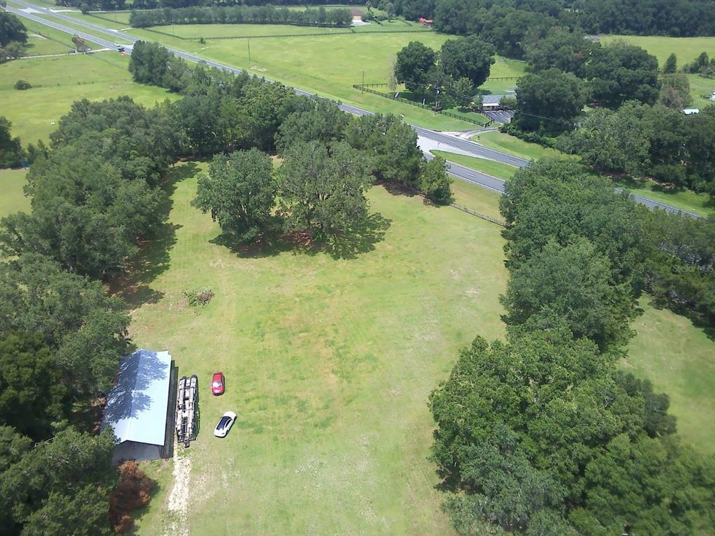 1 North US Highway 441 Citra, FL 32113 - Photo 1 of 1 an aerial view of residential houses with outdoor space and trees