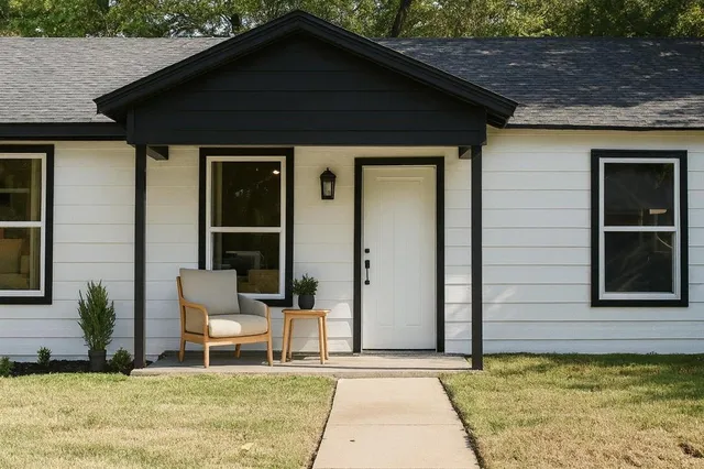 a backyard of a house with chairs