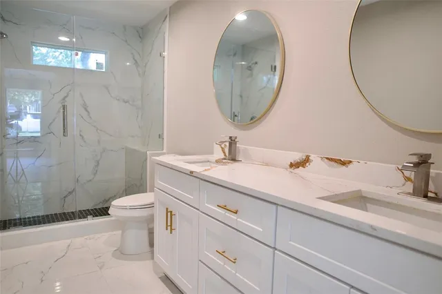 a bathroom with a double vanity sink and a mirror