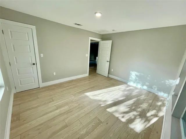 a bedroom with bed and window