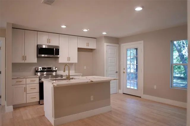 a view of kitchen with furniture and window